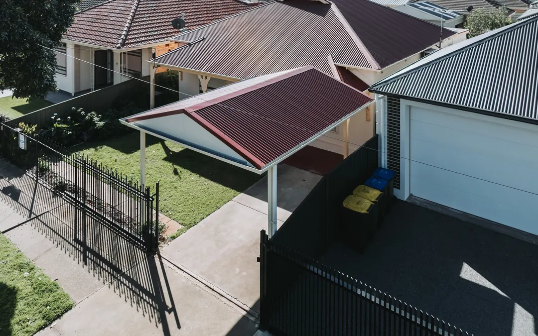 Drone view of a new red gable carport in a Royal Park front yard
