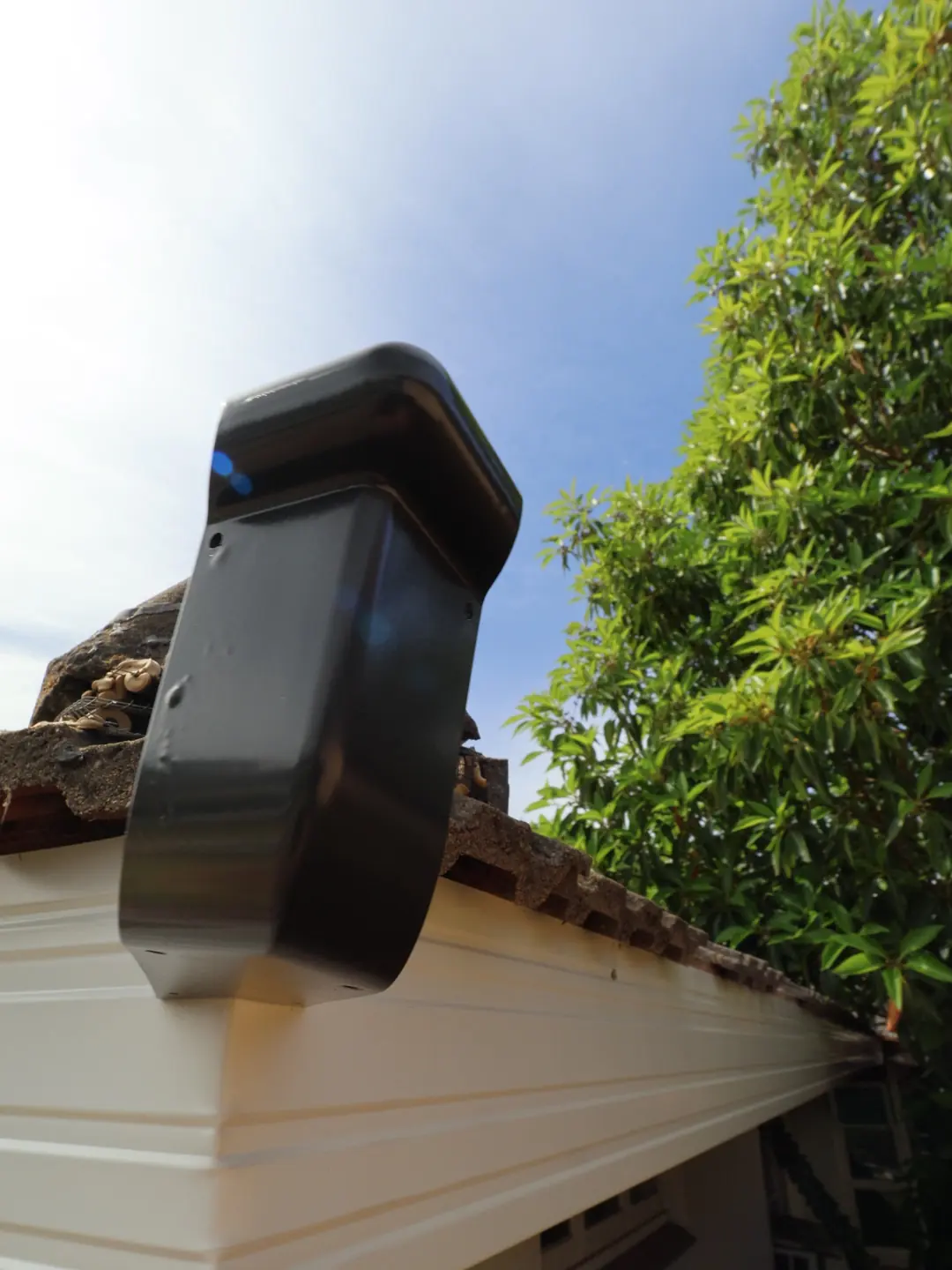 A gutter bracket fixed to new fascia, ready for the gutter