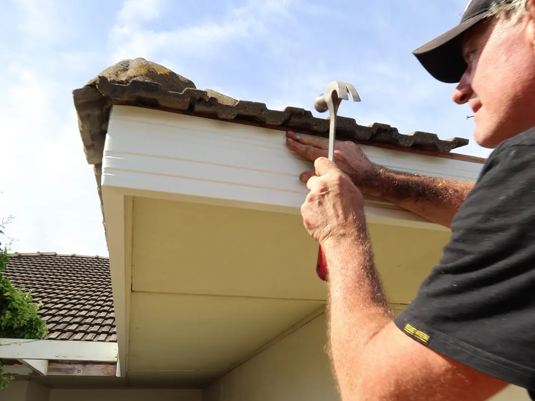 Nailing off a new fascia board under the tiles
