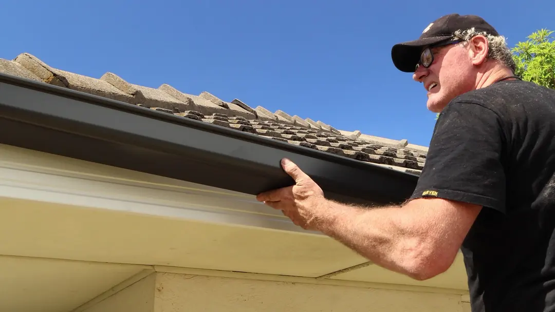 Fitting a new Colorbond gutter along the eave
