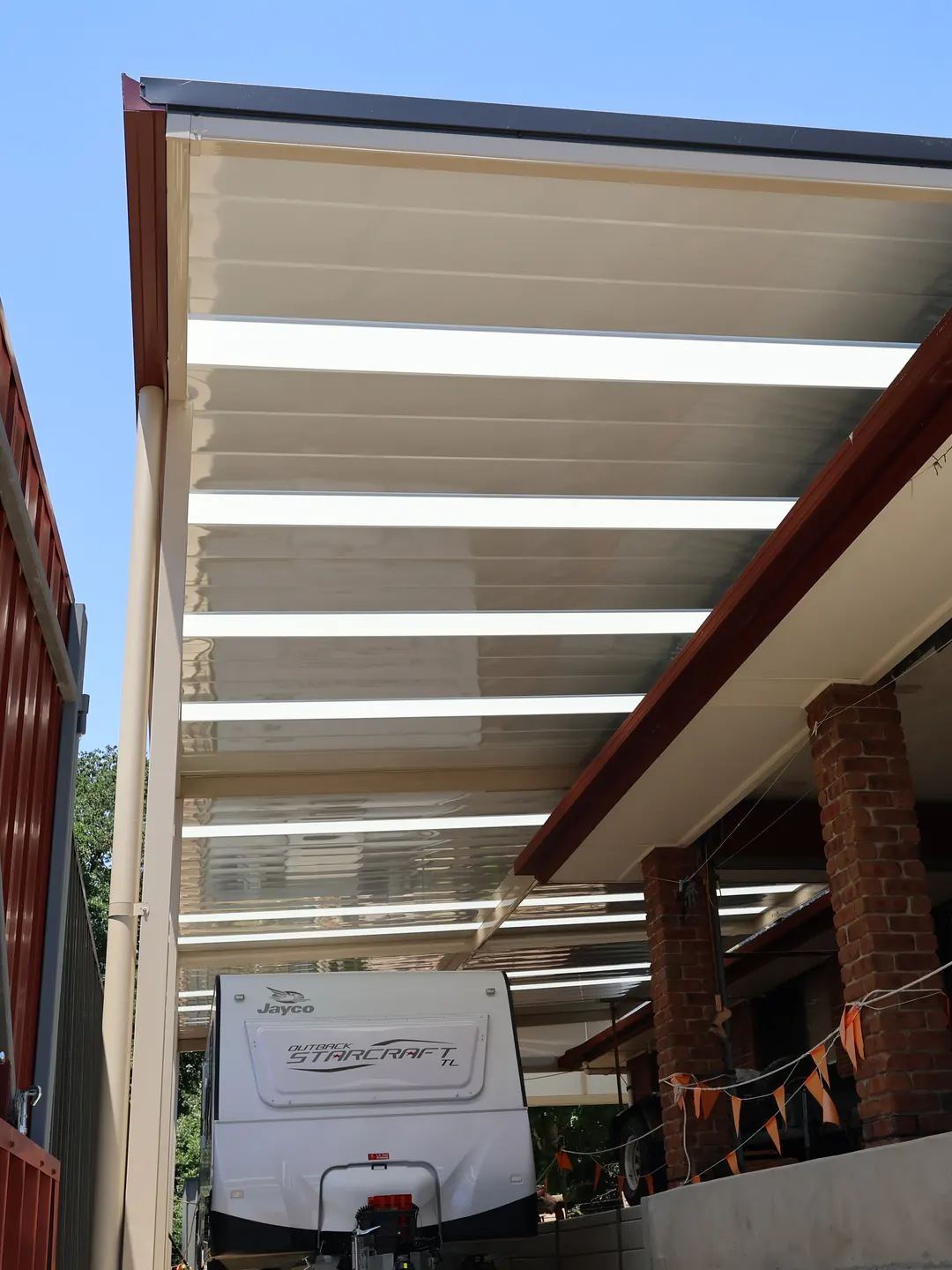 Under a new verandah with clear roof panels, Gumeracha